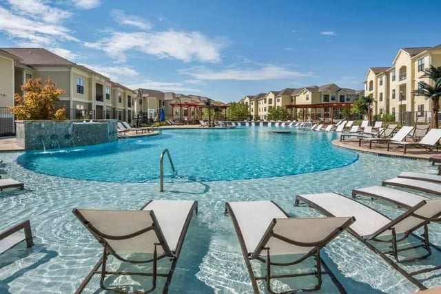 Large pool with lounge chairs and buildings Exterior at The Domain at Columbia in Columbia Student Accommodation