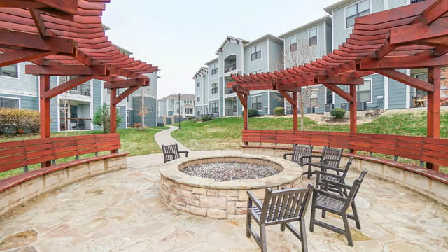 Pergola fire pit stone patio and chairs outdoor living area at The Domain at Columbia in Columbia Student Accommodation