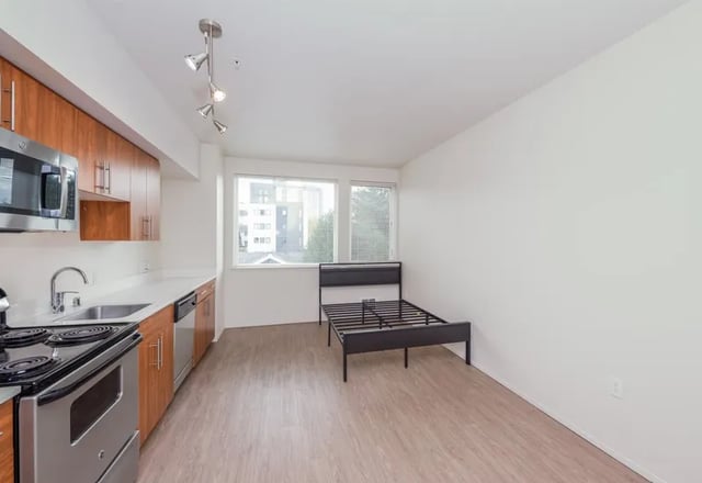 Kitchen with microwave stove and bed frame Studio at Clara Apartments in Seattle Student Accommodation