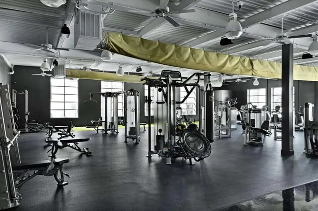 Weight machines punching bag exercise equipment gymnasium at The Vic in Greensboro Student Accommodation