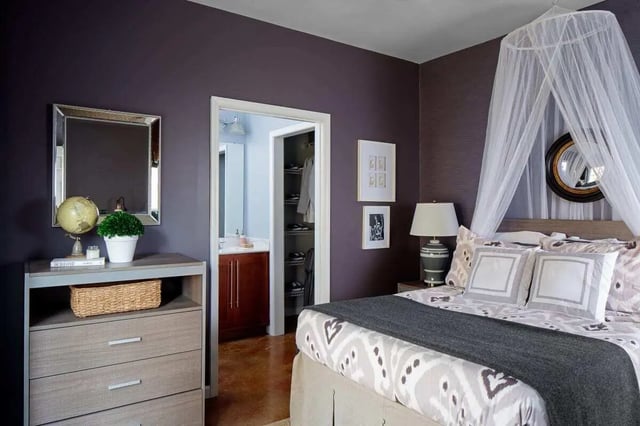 Bed with canopy dresser mirror closet bathroom bedroom at The Vic in Greensboro Student Accommodation