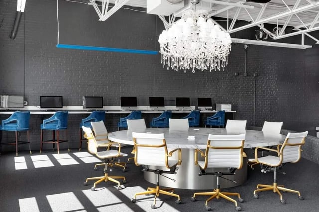 Computers blue chairs round table white chairs study area at The Vic in Greensboro Student Accommodation