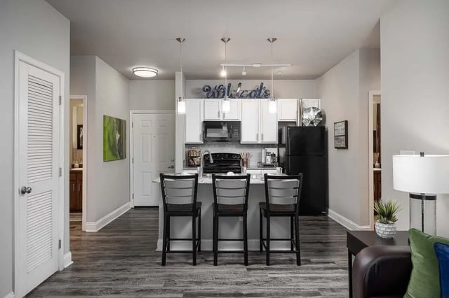 Kitchen with island and bar stools kitchen area at The Lex in Lexington Student Accommodation