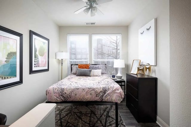 Bed with patterned bedding and lamps bedroom at The Lex in Lexington Student Accommodation