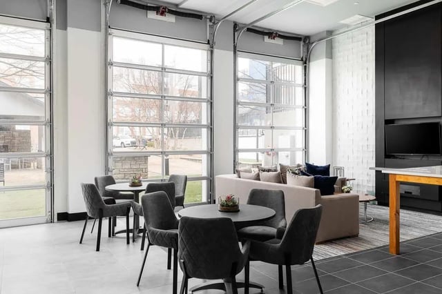 Seating area with couches and tables lounge area at The Lex in Lexington Student Accommodation