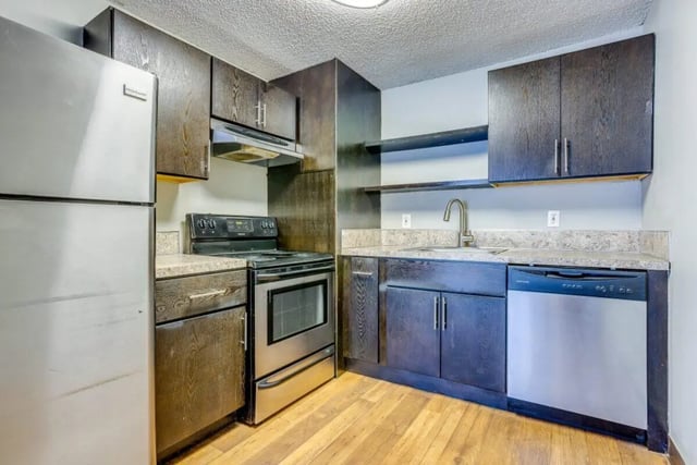 Stainless steel refrigerator stove dishwasher kitchen cabinets kitchen at Connery Place Apartments in Portland Student Accommodation