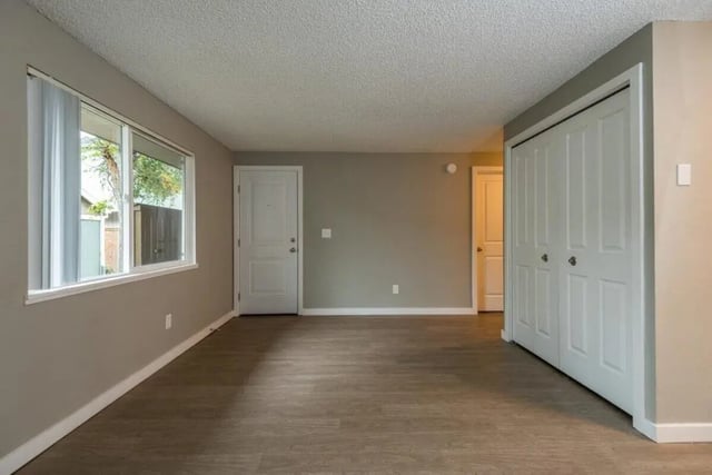 Large window with white blinds and two doors living room at Connery Place Apartments in Portland Student Accommodation