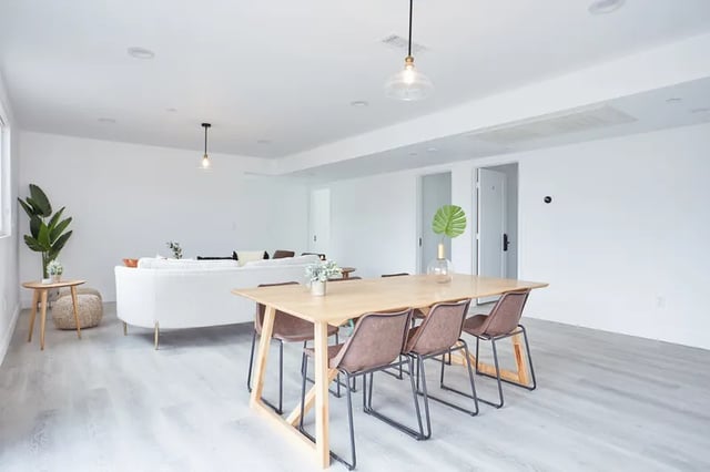 Dining table chairs sofa plant living room at 1360 W 35th St in Los Angeles Student Accommodation