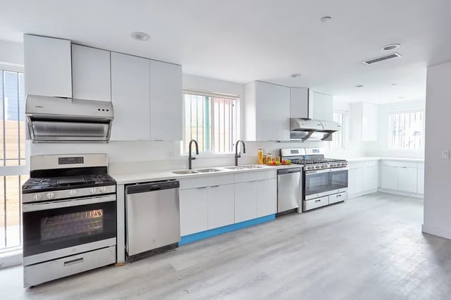 Stove dishwasher sink cabinets modern kitchen interior at 1360 W 35th St in Los Angeles Student Accommodation