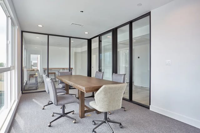 Conference table with chairs glass walls meeting room at 1360 W 35th St in Los Angeles Student Accommodation