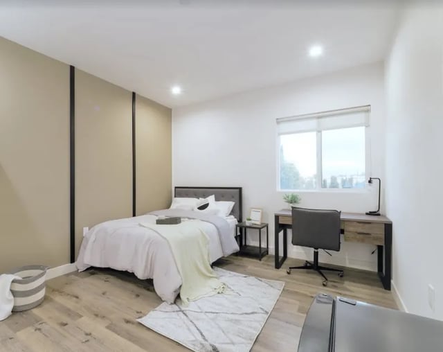 Bed desk chair and laundry hamper bedroom at 1360 W 35th St in Los Angeles Student Accommodation