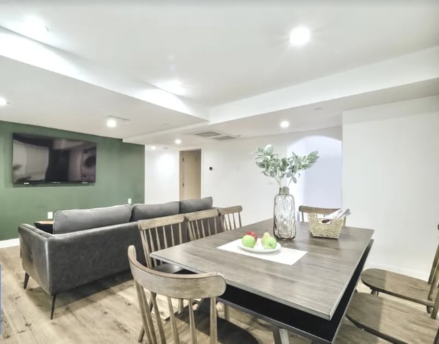 Sofa television and dining table living area at 1360 W 35th St in Los Angeles Student Accommodation
