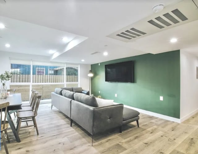 Gray sectional sofa and dining set living room at 1360 W 35th St in Los Angeles Student Accommodation