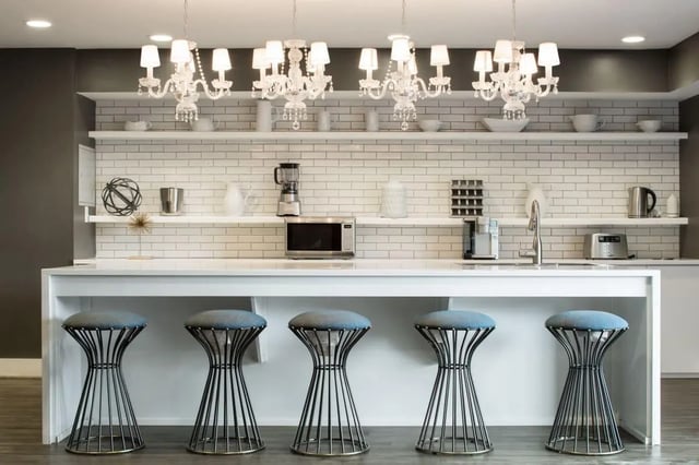 Five stools at a counter with appliances kitchen at The Harrison in Harrisonburg Student Accommodation