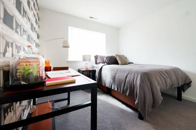 Desk bed lamp with books study area bedroom at The Harrison in Harrisonburg Student Accommodation