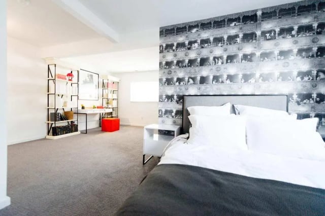 Bed with white pillows and study area bedroom at The Harrison in Harrisonburg Student Accommodation