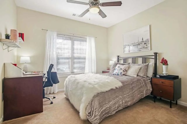 Bed desk chair and artwork bedroom at West 22 in Kennesaw Student Accommodation