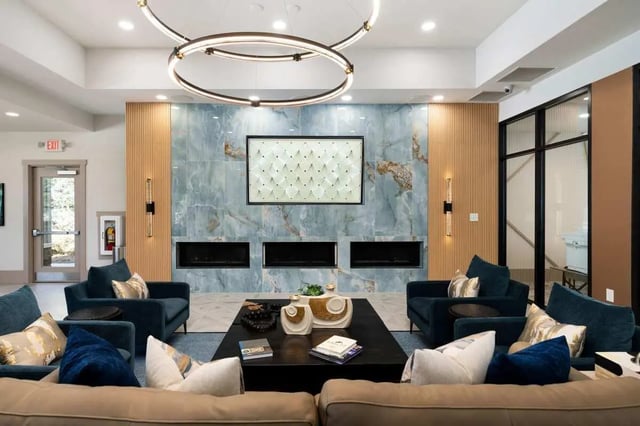 Modern living room with sofas and fireplaces at West 22 in Kennesaw Student Accommodation