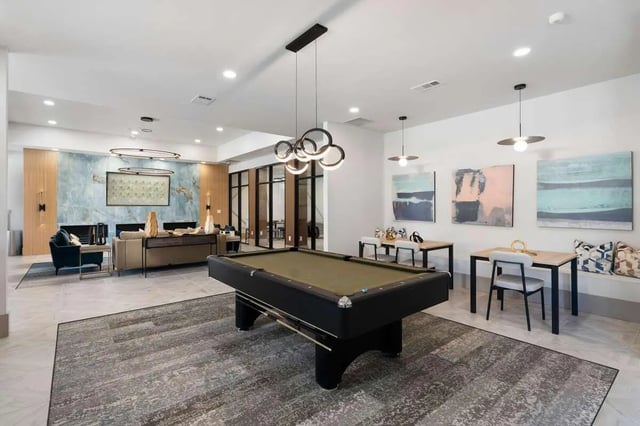 Billiard table seating tables and art game room at West 22 in Kennesaw Student Accommodation