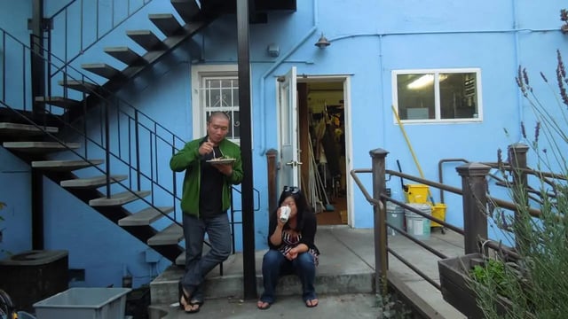 Two people eating and drinking exterior at Berkeley Student Cooperative - Affordable Student Housing Co-op in Berkeley Student Accommodation