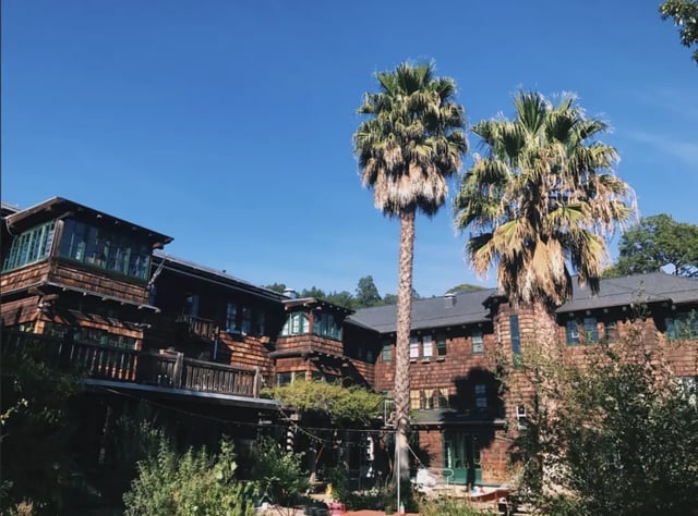 Wooden building with balconies palm trees exterior at Berkeley Student Cooperative - Affordable Student Housing Co-op in Berkeley Student Accommodation
