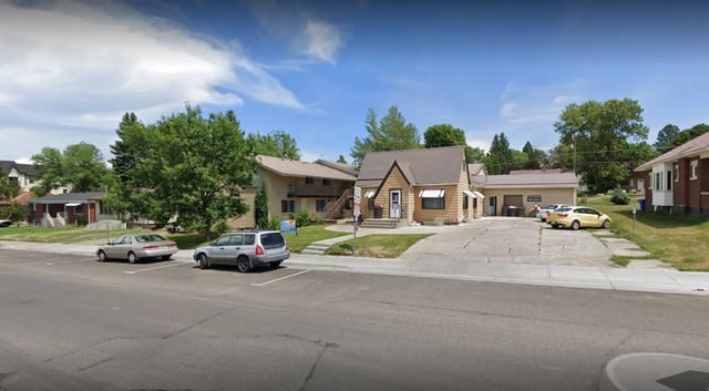 Apartment buildings and cars exterior at Crestwood Rexburg Apartments in Rexburg Student Accommodation