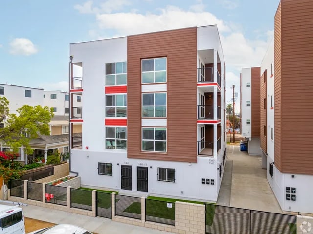 Modern white and brown apartment building exterior at 1476 W 35th St in Los Angeles Student Accommodation