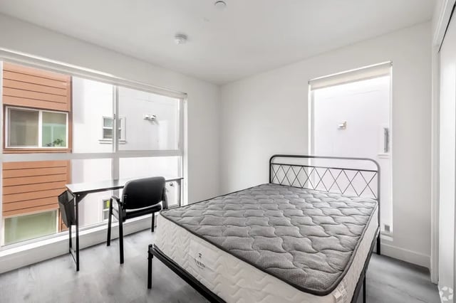 Bed desk chair large window bedroom at 1476 W 35th St in Los Angeles Student Accommodation