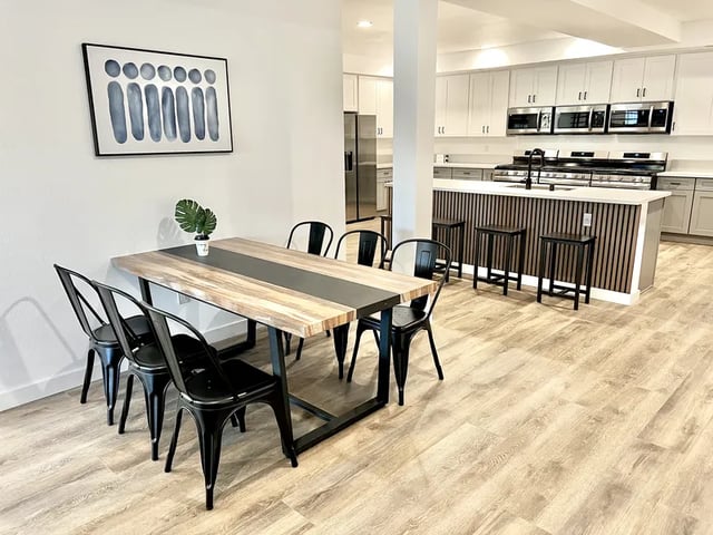 Dining table chairs kitchen island stools living room at 1587 W 35th St in Los Angeles Student Accommodation