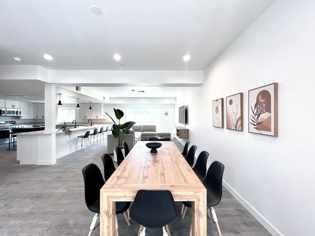 Dining table with chairs kitchen and living area. at 1587 W 35th St in Los Angeles Student Accommodation