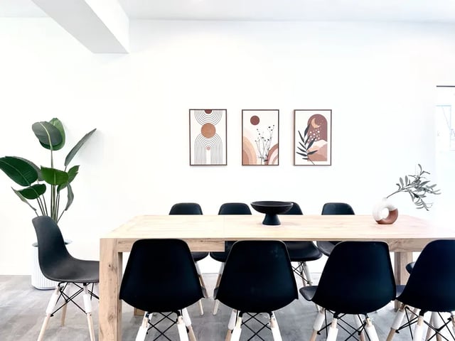 Dining table with chairs and artwork dining area at 1587 W 35th St in Los Angeles Student Accommodation