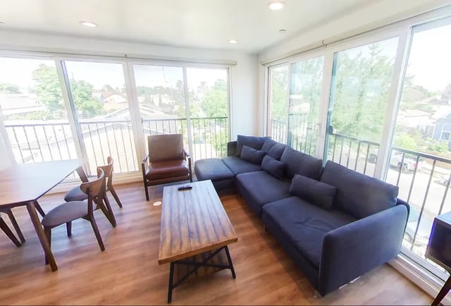 Sectional sofa coffee table dining set living room at 1587 W 35th St in Los Angeles Student Accommodation