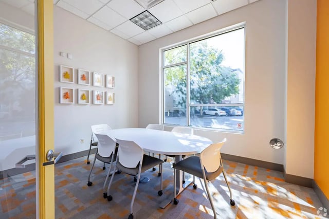 White oval table and chairs meeting room at 65 West in Cincinnati Student Accommodation