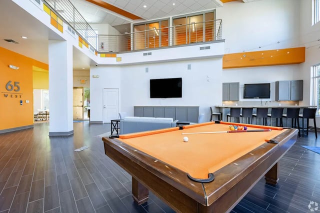 Pool table with balls and cues living room at 65 West in Cincinnati Student Accommodation