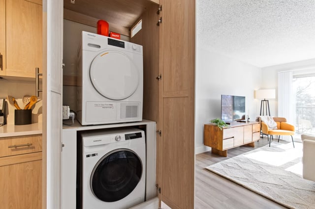 Washer dryer in cabinet kitchen area at Mountainaire Boulder in Boulder Student Accommodation