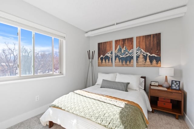 Bed nightstand artwork and window bedroom at Mountainaire Boulder in Boulder Student Accommodation