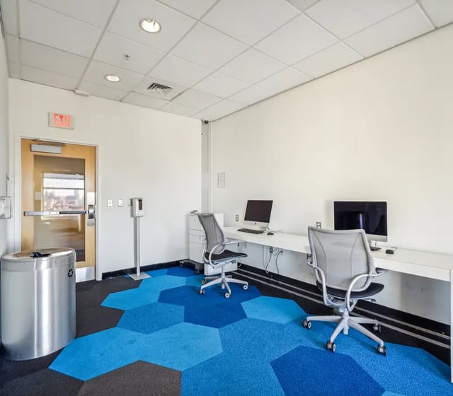 Computers chairs and trash can study area at The View at Montgomery in Philadelphia Student Accommodation
