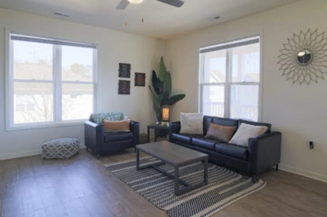 Black leather sofa armchair coffee table living room at Clemson Village in Clemson Student Accommodation