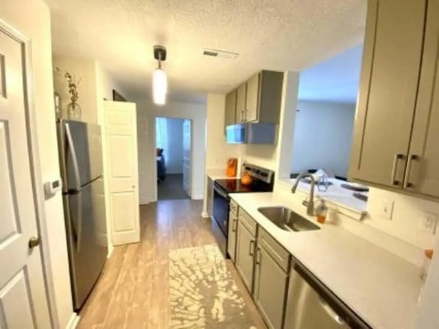 Stainless steel refrigerator cabinets sink countertop kitchen at Clemson Village in Clemson Student Accommodation