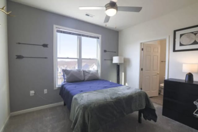 Bed with blue and grey bedding door and dresser Bedroom at Clemson Village in Clemson Student Accommodation