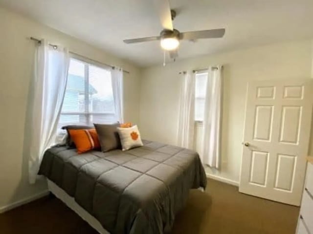 Bed with pillows window fan door bedroom at Clemson Village in Clemson Student Accommodation