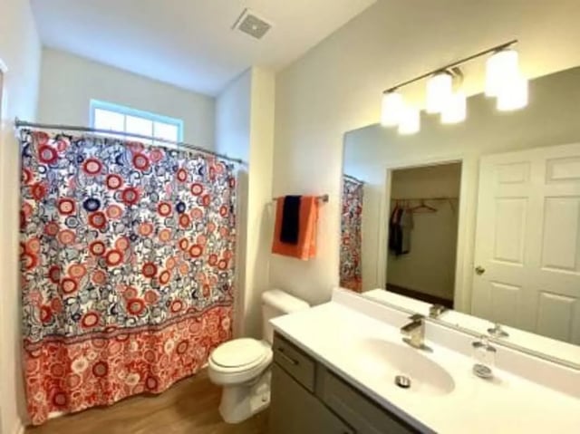 Toilet patterned shower curtain and vanity bathroom at Clemson Village in Clemson Student Accommodation