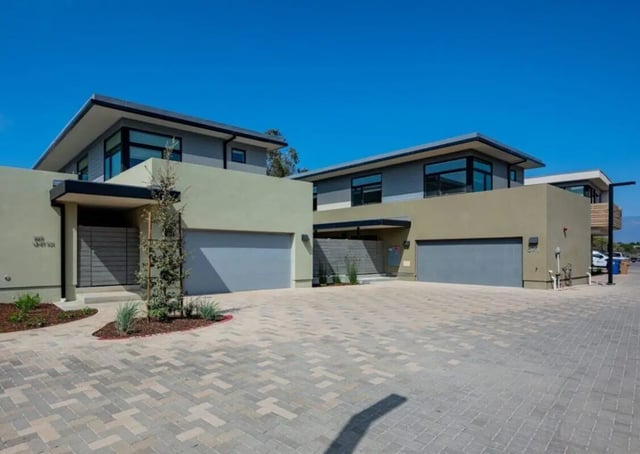 Modern townhouses with garages and driveways exterior at The Cove Santa Barbara in Isla Vista Student Accommodation