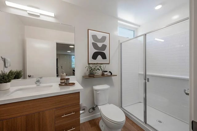 Modern bathroom with vanity toilet and shower stall at The Cove Santa Barbara in Isla Vista Student Accommodation