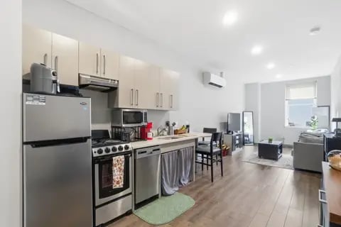 Kitchen with appliances living area with furniture Interior at Polk On Third - Off Campus Student Housing in Bethlehem Student Accommodation
