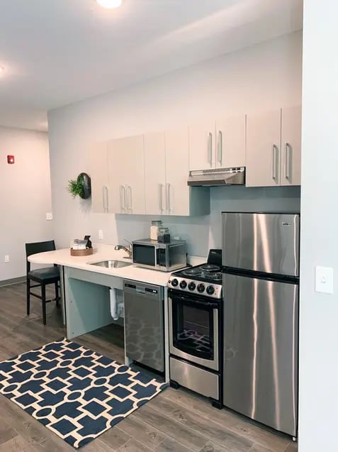 Stainless steel fridge microwave stove dishwasher kitchen at Polk On Third - Off Campus Student Housing in Bethlehem Student Accommodation