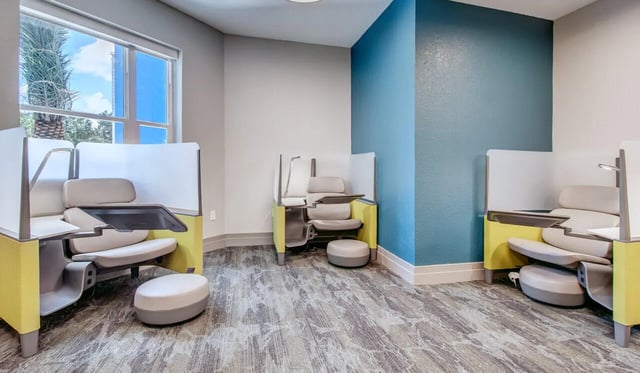 Study pods with chairs and ottomans study area at Cascades Luxury Apartments in Gainesville Student Accommodation
