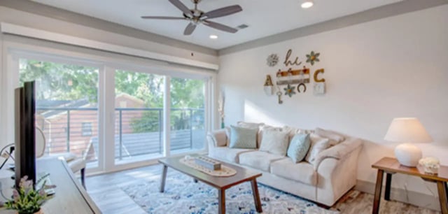 Sofa coffee table floor lamp living room at Cascades Luxury Apartments in Gainesville Student Accommodation