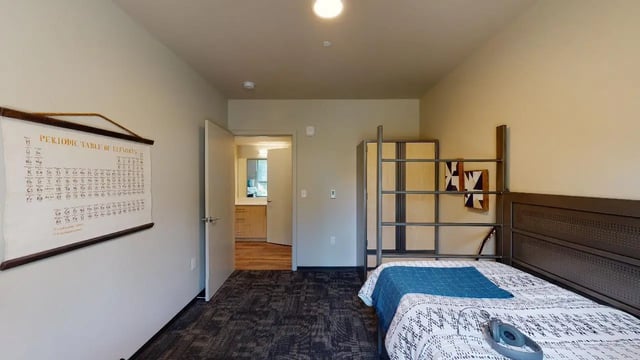 Periodic table poster metal bunk bed bedroom at 7000 Campus Living Apartments in Shoreline Student Accommodation