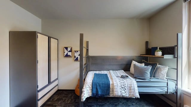 Bunk bed wardrobe artwork and guitar bedroom at 7000 Campus Living Apartments in Shoreline Student Accommodation